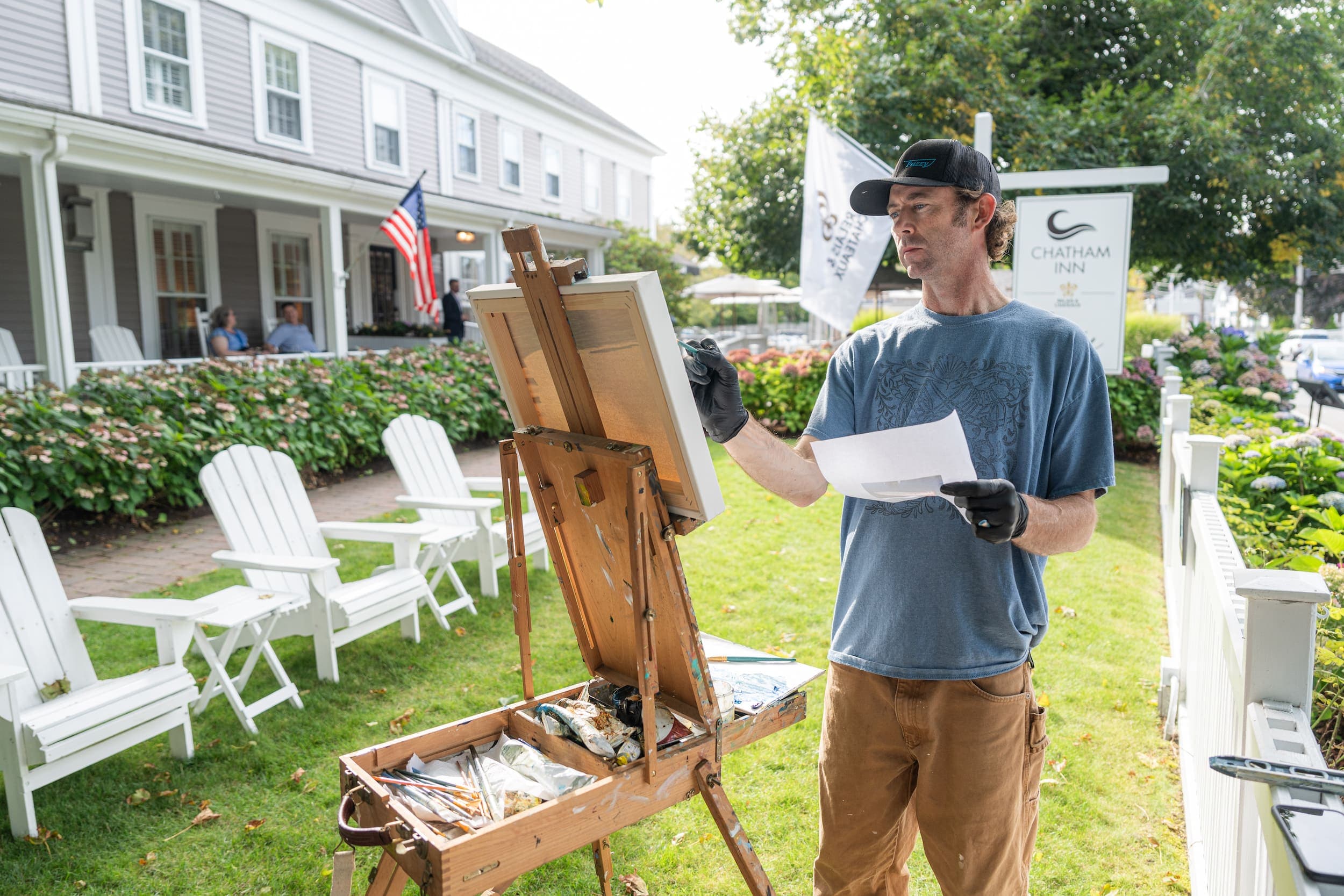 Jamie O'Neill painting out front of Chatham Inn