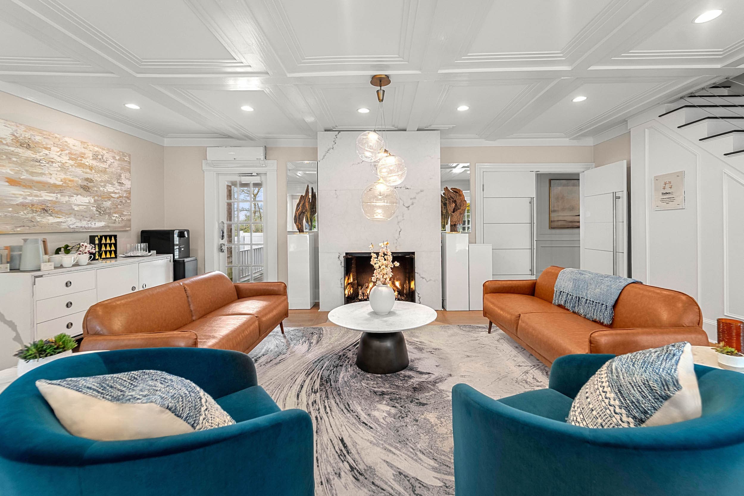 A space for buyouts in Chatham Inn with plenty of lounge seating, coffee and beverage bar with a gorgeous fireplace