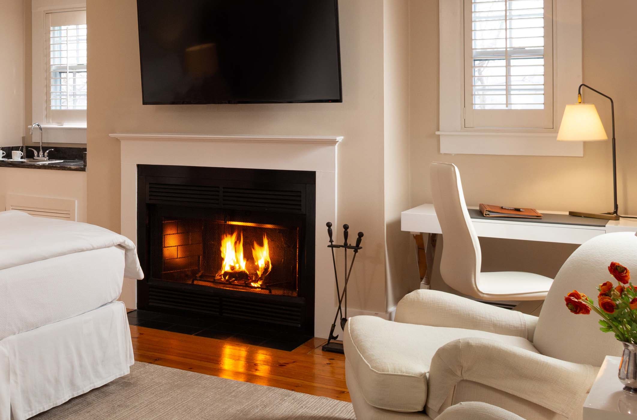 A gorgeous fireplace and desk area in Room 3 at Chatham Inn