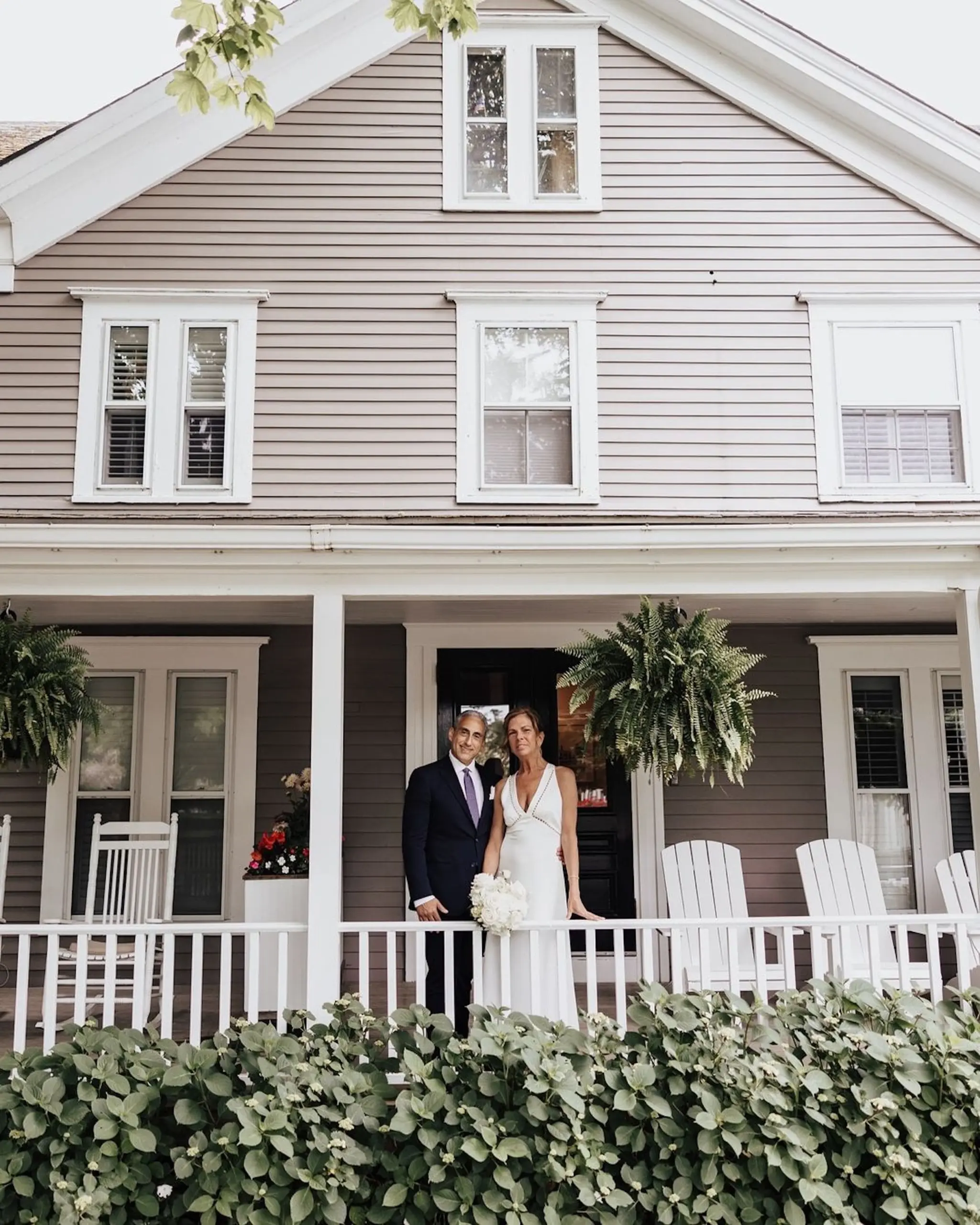 A married couple on a patio at Chatham Inn